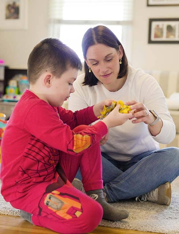 Caitlin playing with her son