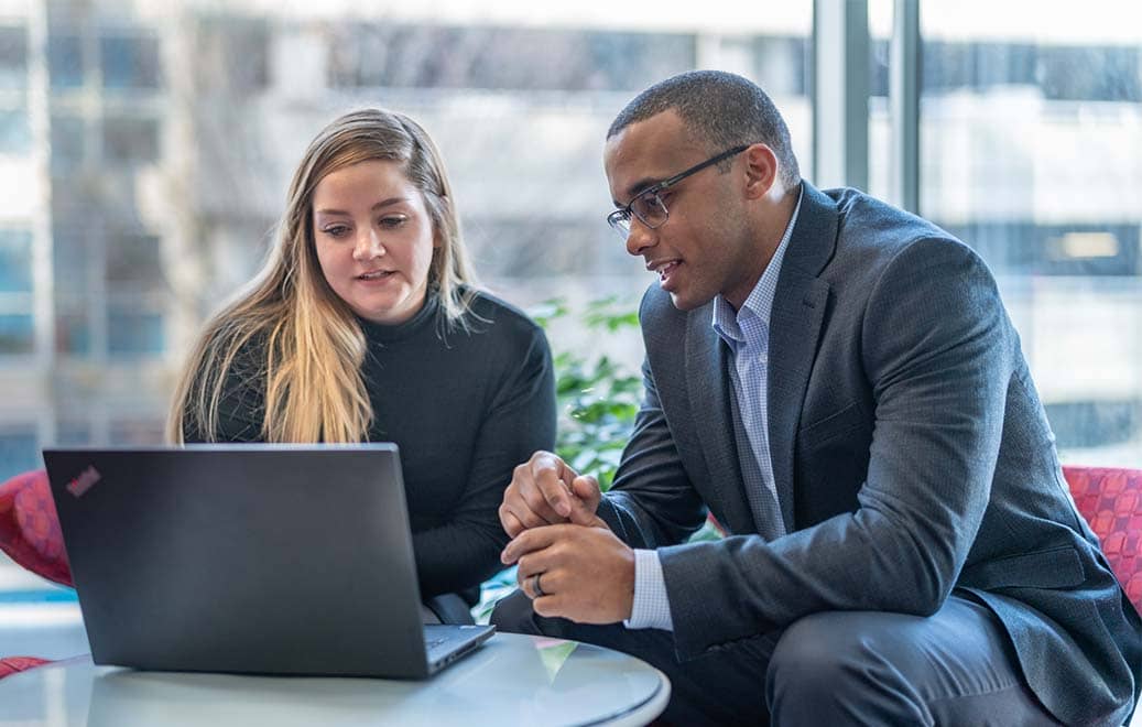 Two Biogen employees meeting